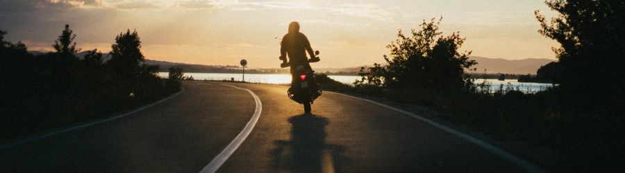 man riding his motorcycle